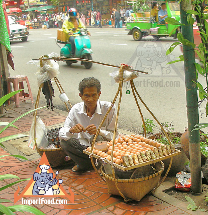 Thai Street Vendor Offers Sticky Rice Wrapped in Banana Leaves, Kao Neeo Khai Ping