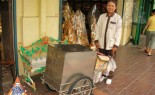 Thai Street Vendor Offers Yakult Sour Milk from a Push Cart