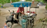 Thai Street Vendor Prepares Decorative Pancakes