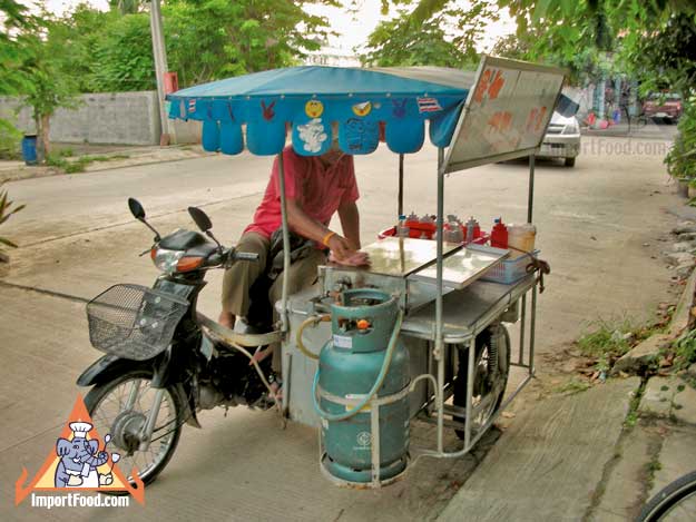 Thai Street Vendor Prepares Decorative Pancakes