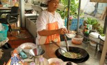 Thai Street Vendor Prepares Thai-Style Noodles in Gravy, Ladna